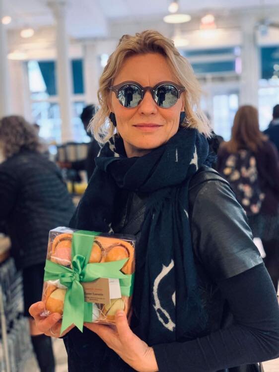 a lady holding a cookies box