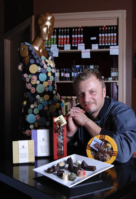 Fritz Knipschildt with boxes of chocolates