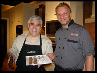 Fritz Knipschildt with another chief and a plate of chocolate